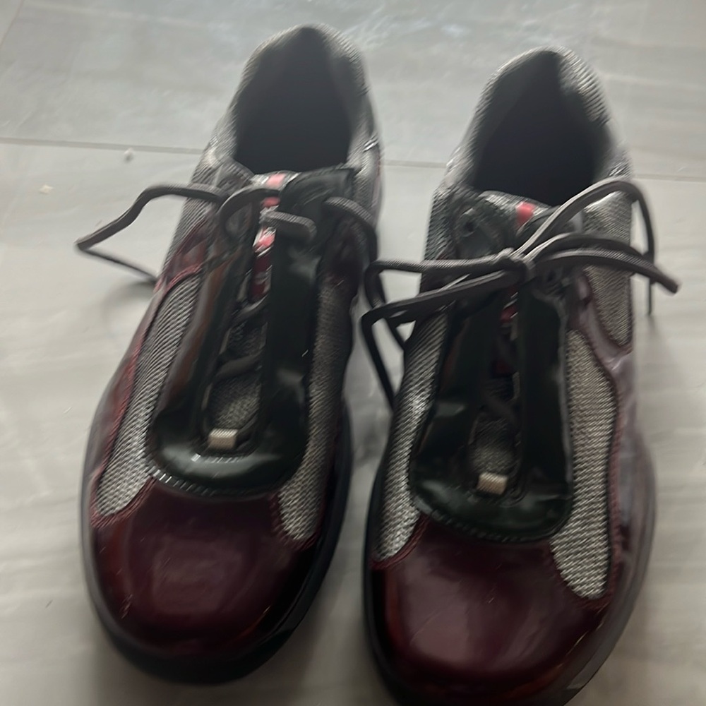 Prada burgundy and silver size 12 men’s sneakers.